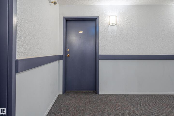 Property Photo: 1628 48 Street NW 203 AB T6L 5P2