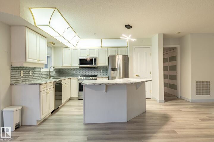 Property Photo:  6703 172 Street NW 106  AB T5T 6H9 