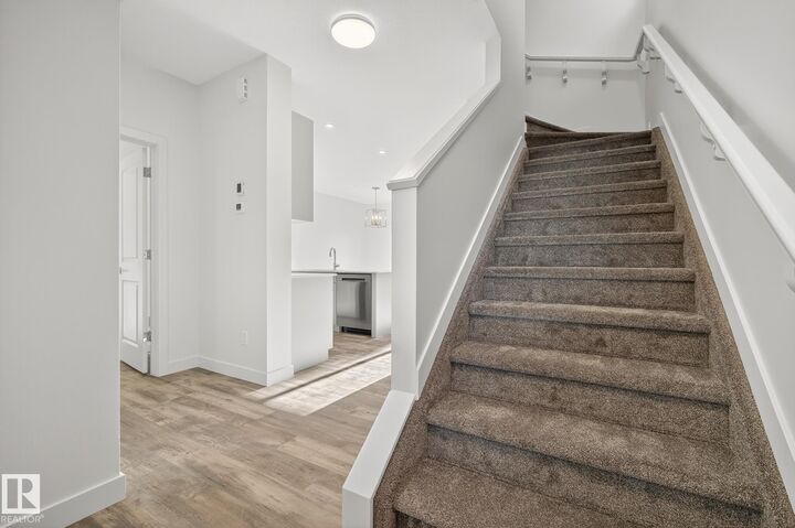 Property Photo: 5122 213A Street NW 5 AB T6M 0K7