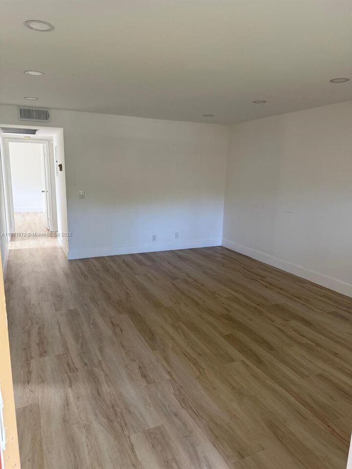 Property Photo:  100 SW 132nd Way 205K  FL 33027 