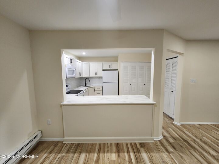 Property Photo:  129 Amberly Drive H  NJ 07726 