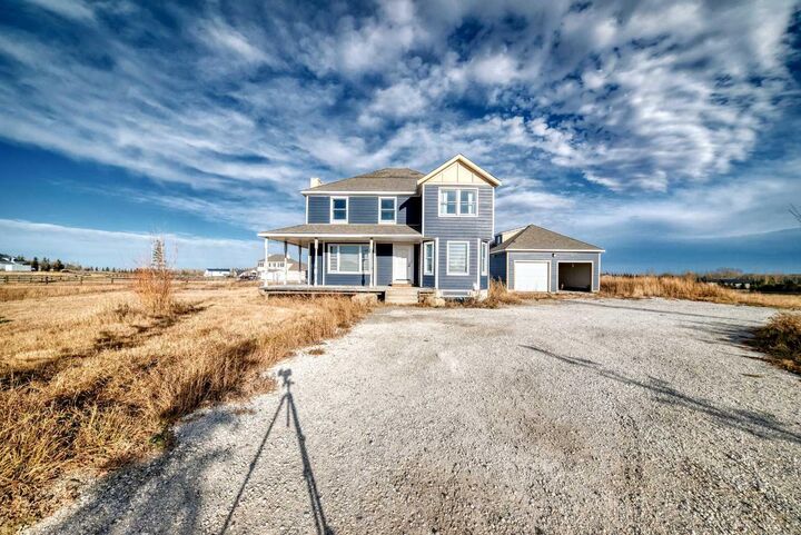 Property Photo: 266106 21 Street W AB T1S 1A2