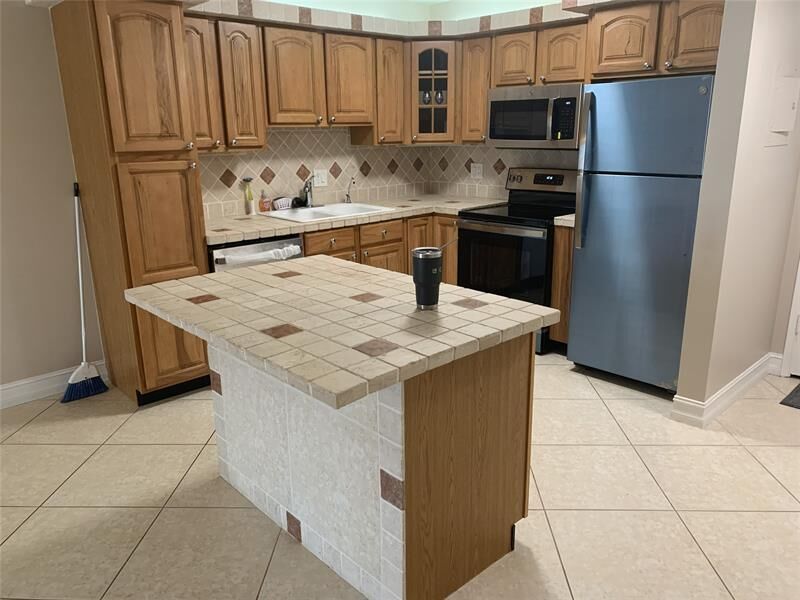 Property Photo:  253 S Cypress Rd 225  FL 33060 