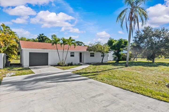 Property Photo: 8379 SE Camellia Drive FL 33455