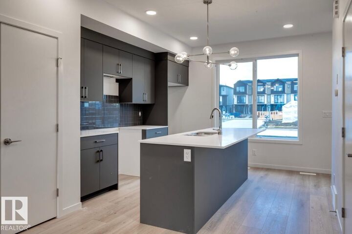 Property Photo:  7528 Klapstein Link Link SW  AB T6W 5S7 