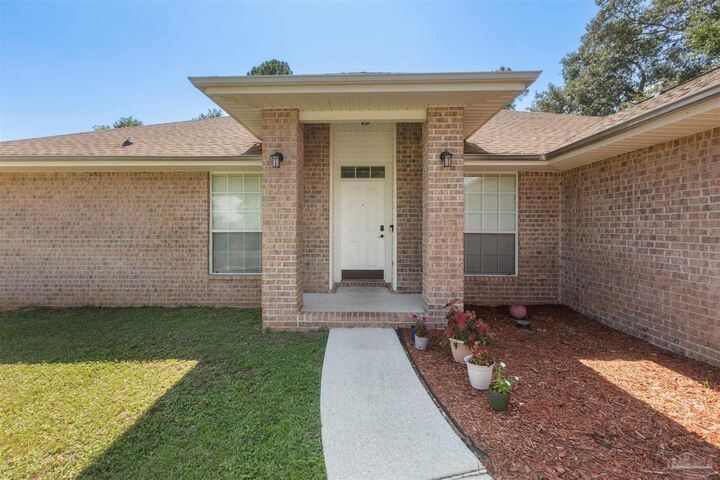 Property Photo:  6917 Kapok Dr  FL 32583 