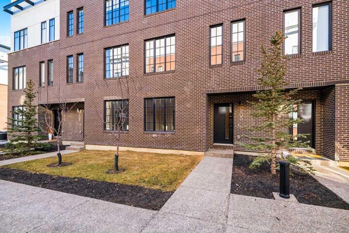 Property Photo: 8155 8 Avenue SW 208 AB T3H 6B1