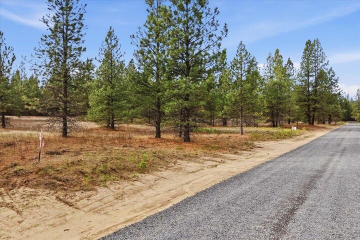 Property Photo:  65xx Whispering Pines Way Lot #3  WA 99026 
