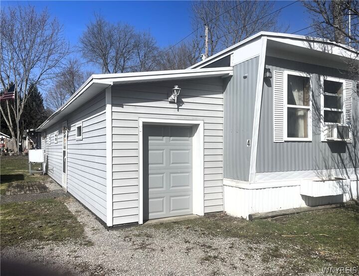 Property Photo:  7207 Hunters Creek #4 Road 4  NY 14080 