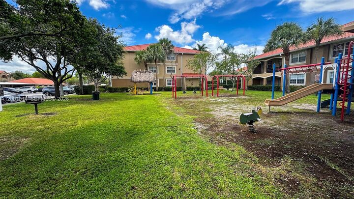 Property Photo:  11700 SW 2nd St 13-201  FL 33025 
