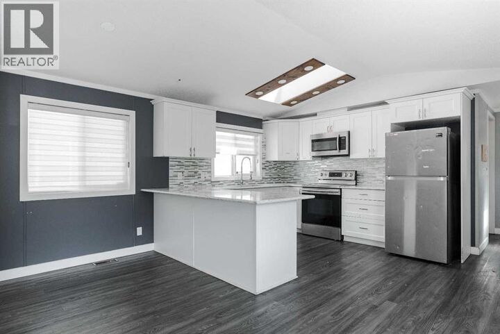 Property Photo:  216 Harpe Way  AB T9K 2K8 