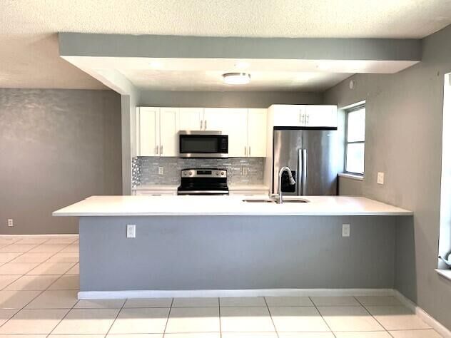 Property Photo:  580 High Point Drive B  FL 33445 