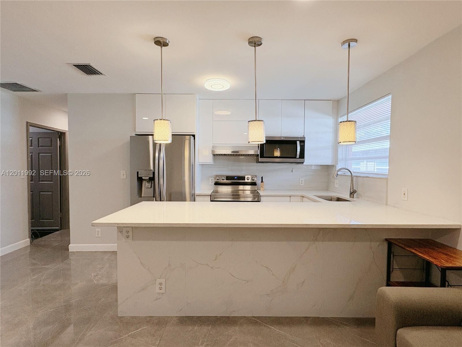 Property Photo:  724 NE 3rd St 1  FL 33009 