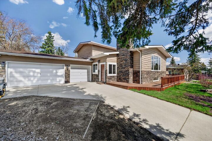 Property Photo:  8 Slocan Road SW  AB T2W 0S8 