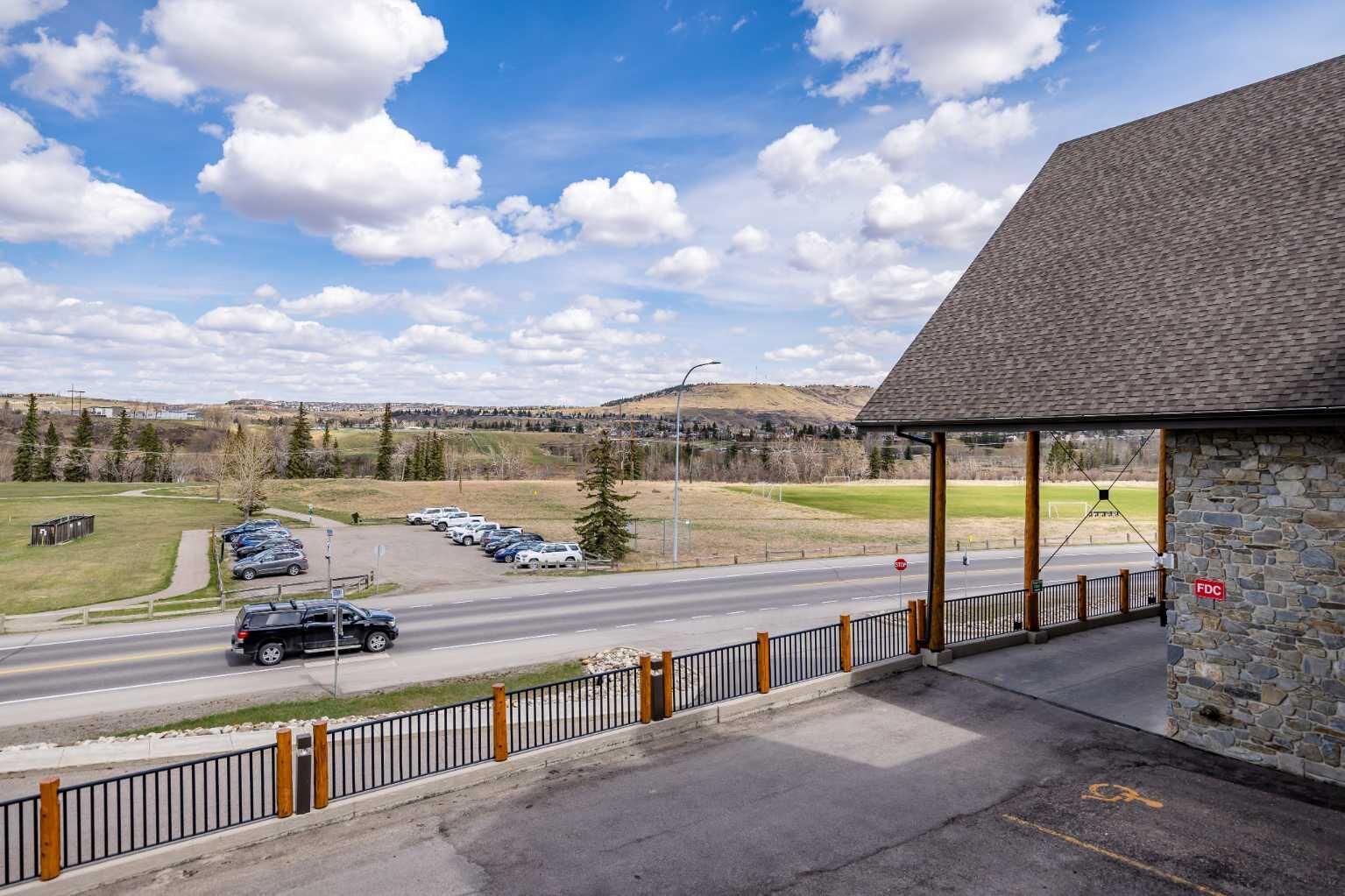Property Photo:  77 George Fox Trail W 213  AB T4C 0N1 