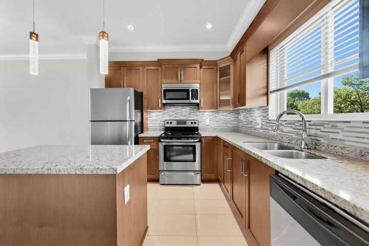 Property Photo:  7159 Stride Avenue 203A  BC V3N 1T8 