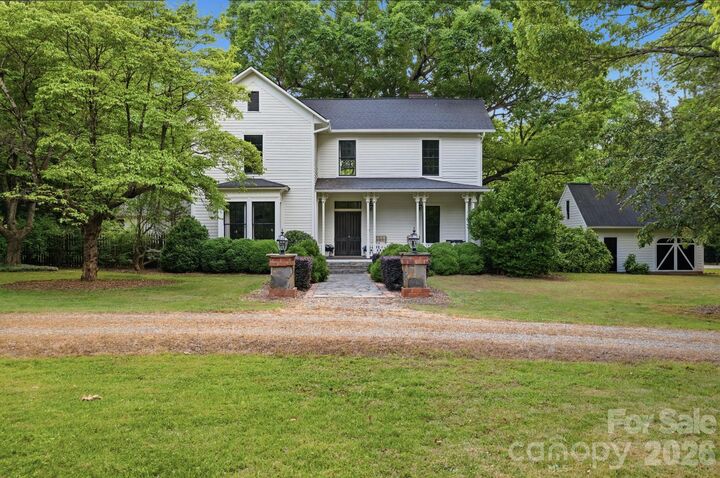 Property Photo:  10915 Beatties Ford Road  NC 28078 