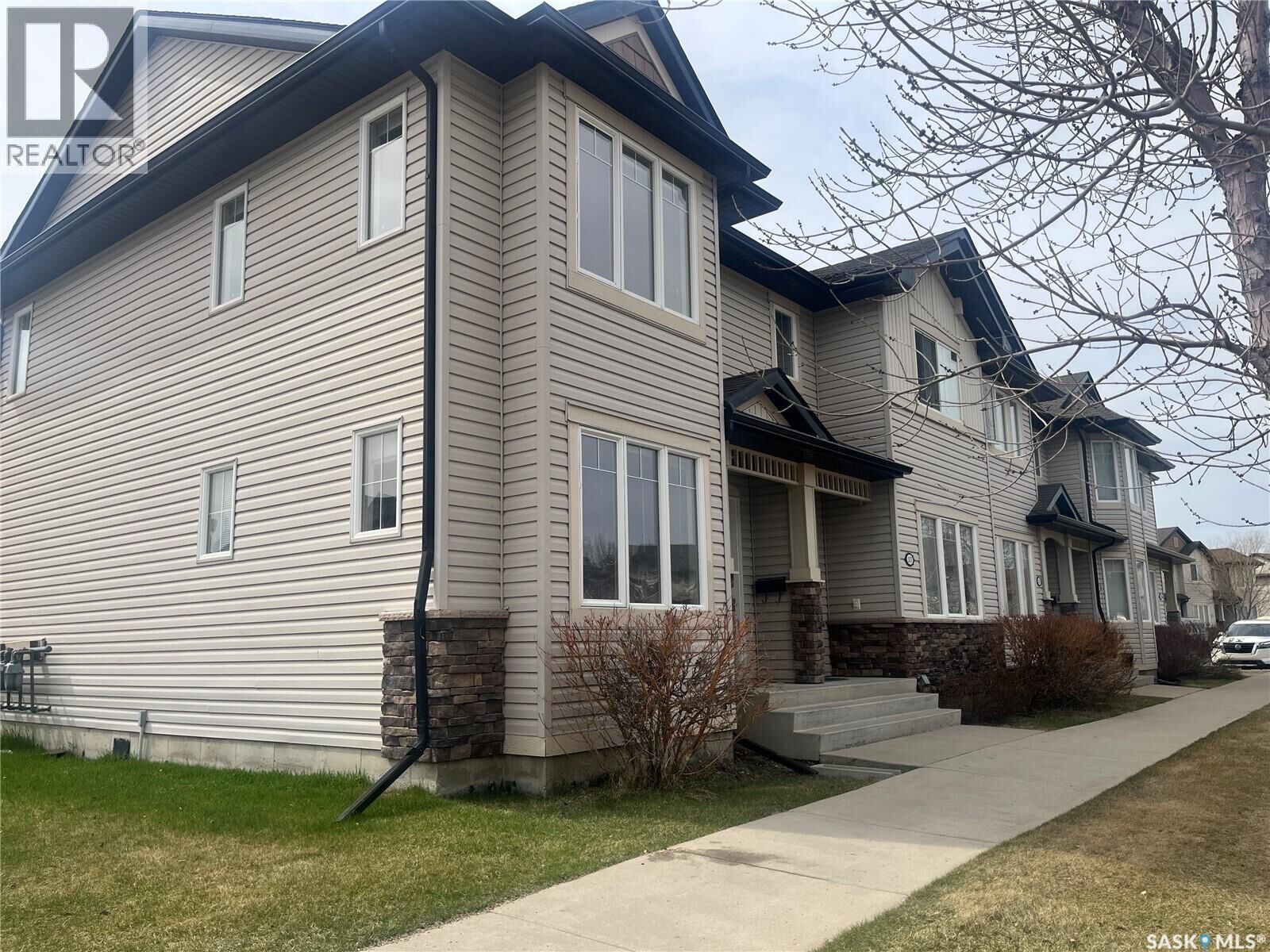 Property Photo:  207 303 Slimmon Place  SK S7V 0A8 
