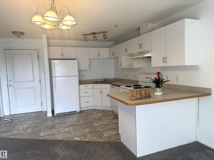 Property Photo:  11325 83 Street NW 210  AB T5B 4W5 