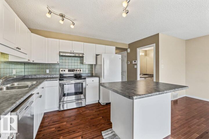 Property Photo:  12148 16 Avenue SW  AB T6W 1L8 