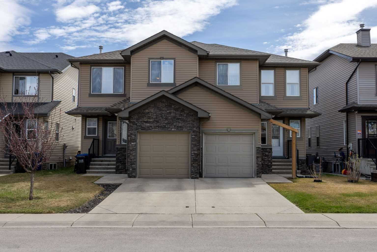 Property Photo:  133 Luxstone Way SW  AB T4B 3C2 