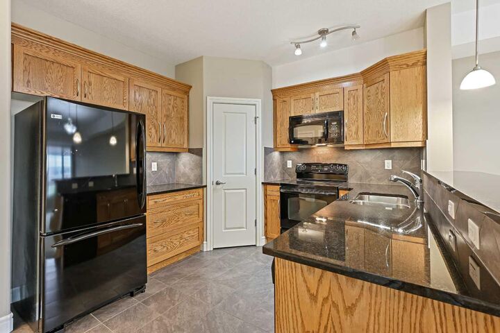 Property Photo:  2330 Fish Creek Boulevard SW 1243  AB T2Y 0L1 