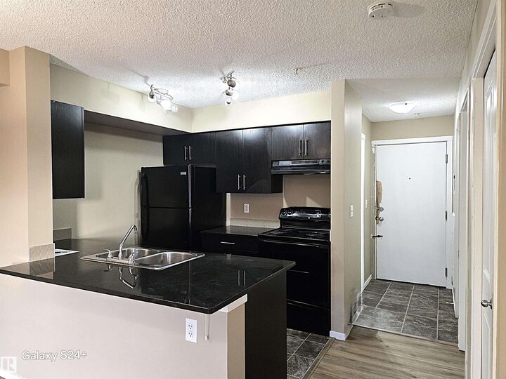 Property Photo: 3207 James Mowatt Trail SW 210 AB T6W 3L6