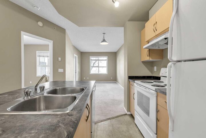 Property Photo: 73 Erin Woods Court SE 1103 AB T2B 3V2
