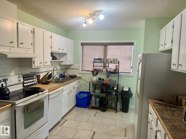 Property Photo:  202 22 Street  AB T9M 1E8 