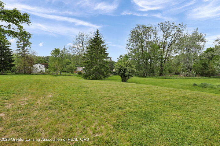 Property Photo:  5006 Christiansen Road  MI 48910 