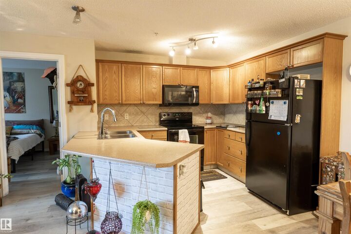 Property Photo:  4403 23 Street NW 203  AB T6T 0E4 