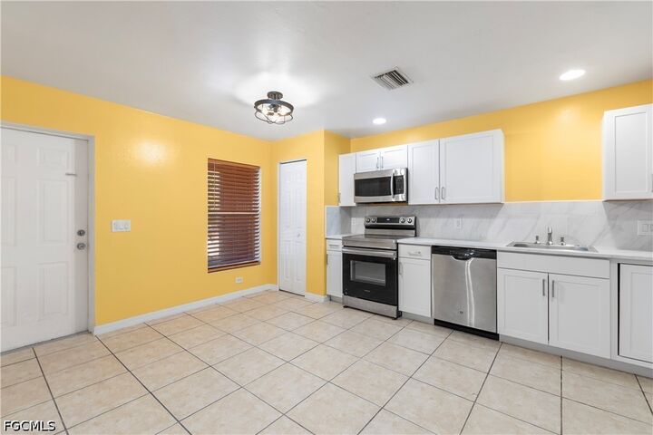 Property Photo: 2405/2407 George Avenue S FL 33973