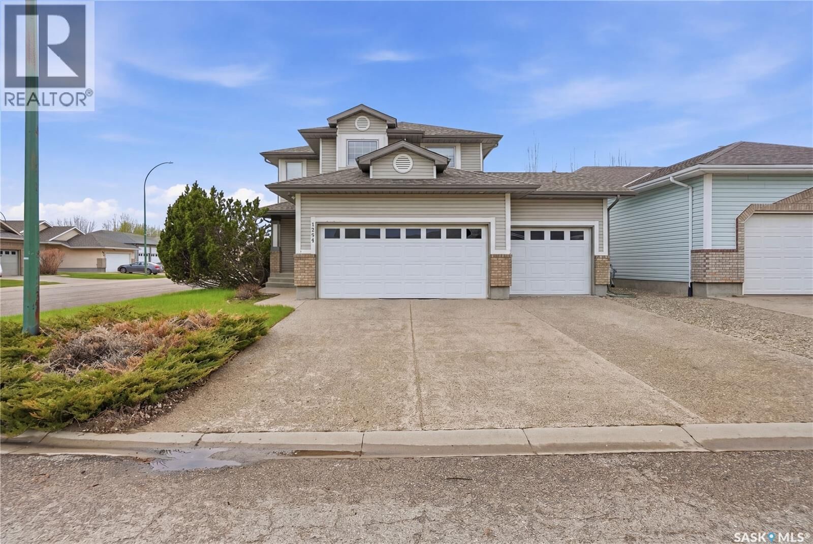 Property Photo:  1204 Boehm Bay N  SK S4X 4M2 