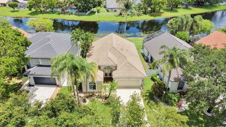 Property Photo:  6672 Remington Place  FL 33463 