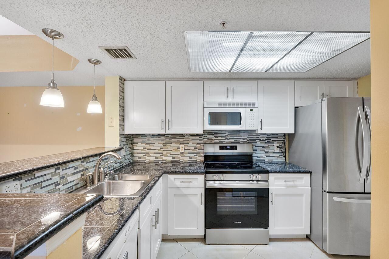 Property Photo:  5011 Wiles Road 303  FL 33073 