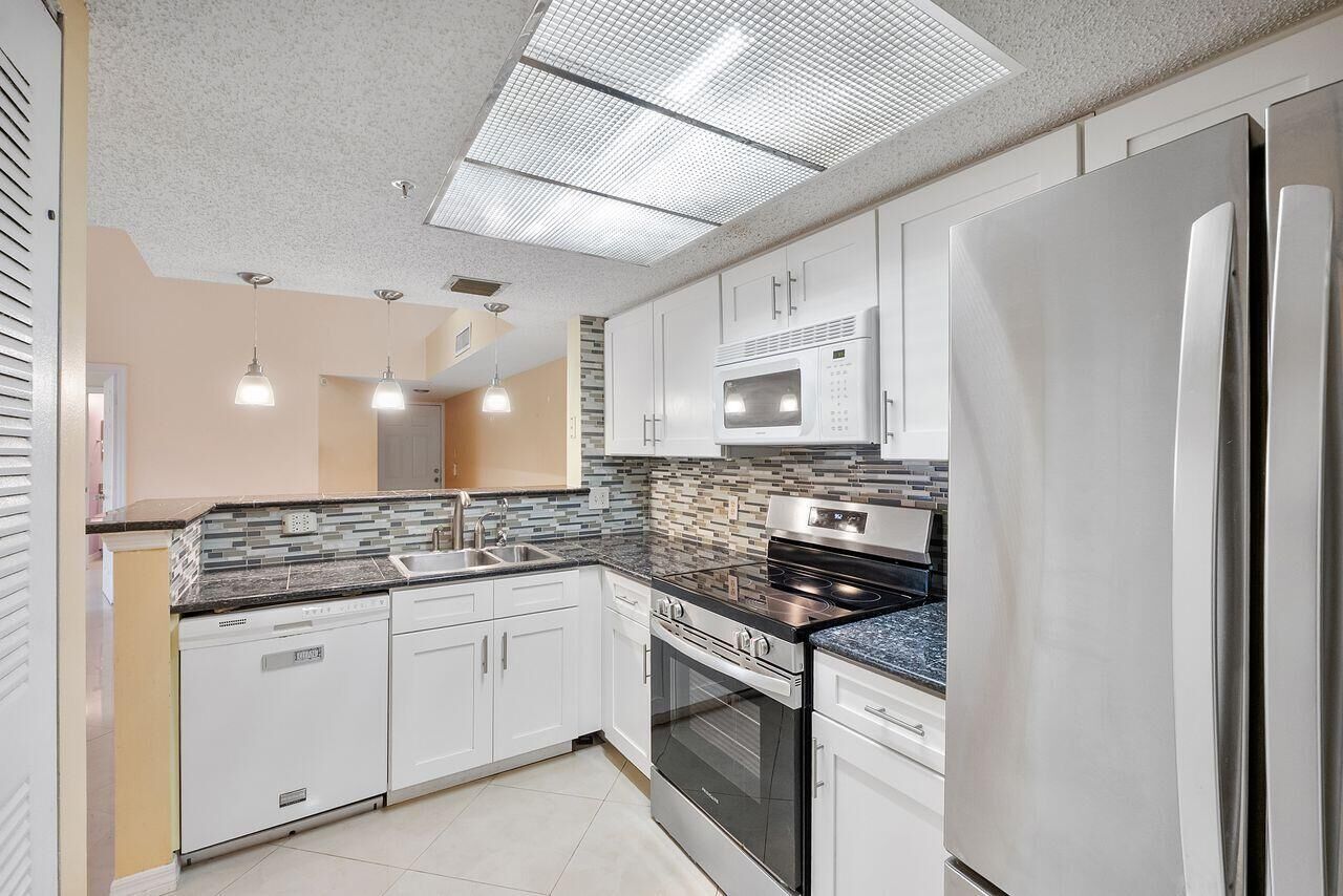Property Photo:  5011 Wiles Road 303  FL 33073 