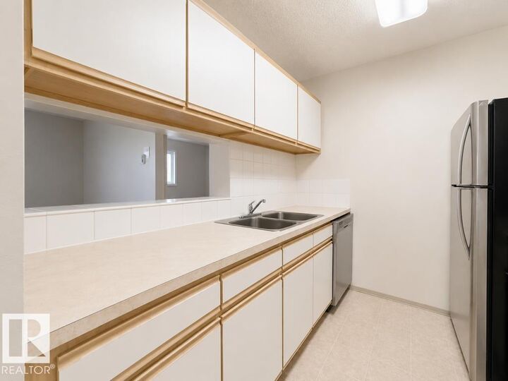 Property Photo:  5065 31 Avenue NW 218  AB T6L 6S5 