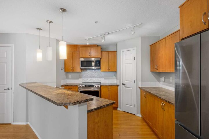 Property Photo:  700 Willowbrook Road NW 2327  AB T4B 0L5 