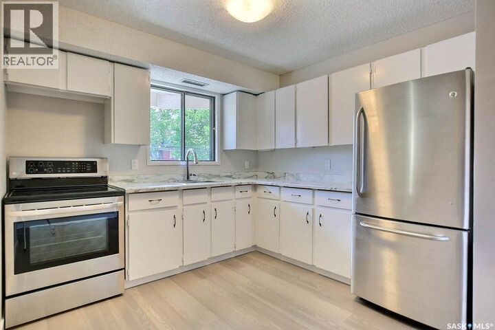 Property Photo:  118 2315 McIntyre Street  SK S4P 3Y8 