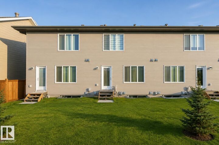 Property Photo:  1537 Sandstone Boulevard  AB T8H 1Z8 