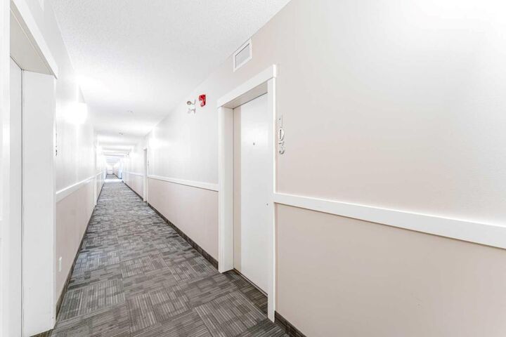 Property Photo:  6703 New Brighton Avenue SE 103  AB T2Z 5C8 