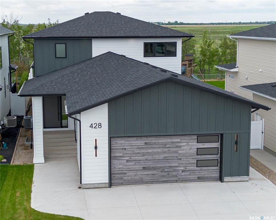 Property Photo: 428 Woolf Bend SK S7W 1E5