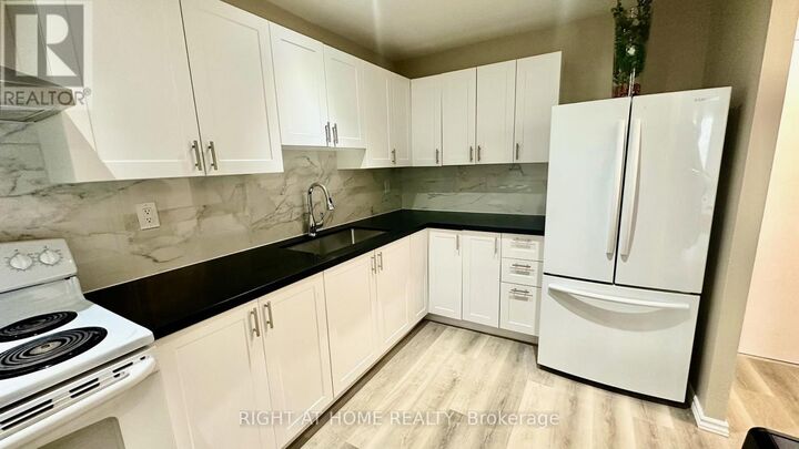 Property Photo: 4064 Lawrence Avenue East 305 ON M1E 4V6