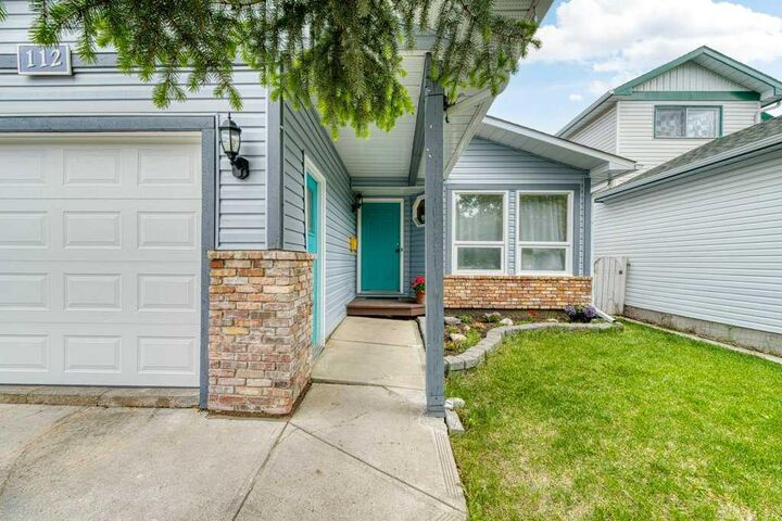 Property Photo: 112 Cedargrove Way SW AB T2W 4V2
