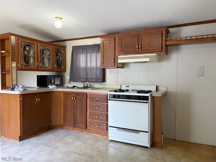 Property Photo: 5411 N River Road W E11 OH 44041