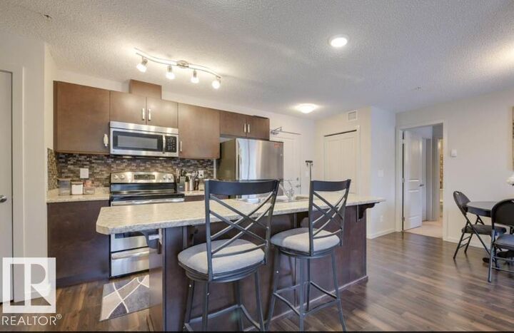 Property Photo: 5521 7 Avenue SW 207 AB T6X 2A8
