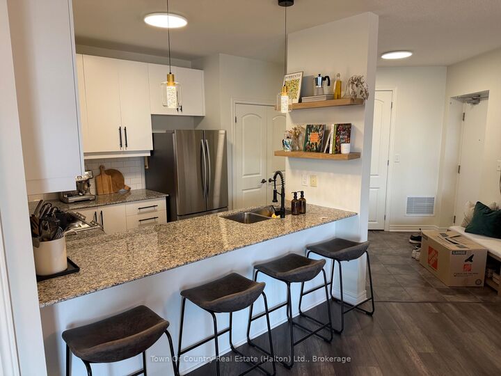 Property Photo:  383 Main Street E 310  ON L9T 8K8 