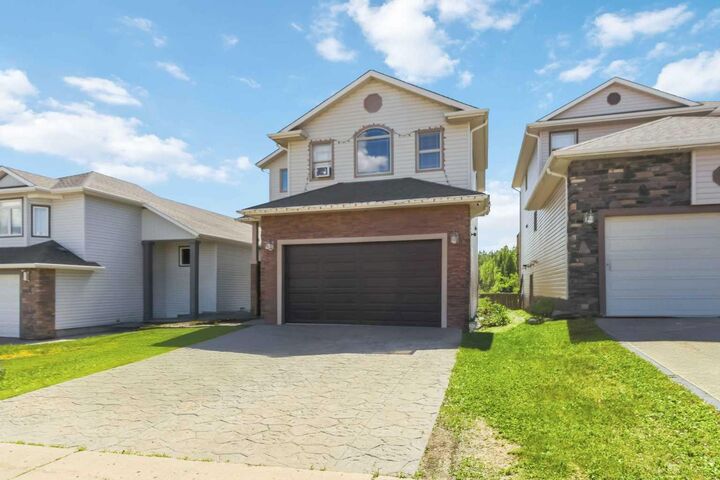 Property Photo: 205 Gravelstone Way AB T9K 0S9