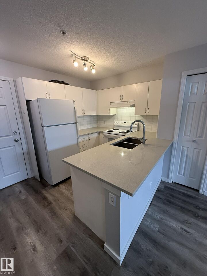 Property Photo: 40 Summerwood Boulevard 106 AB T8H 0C2