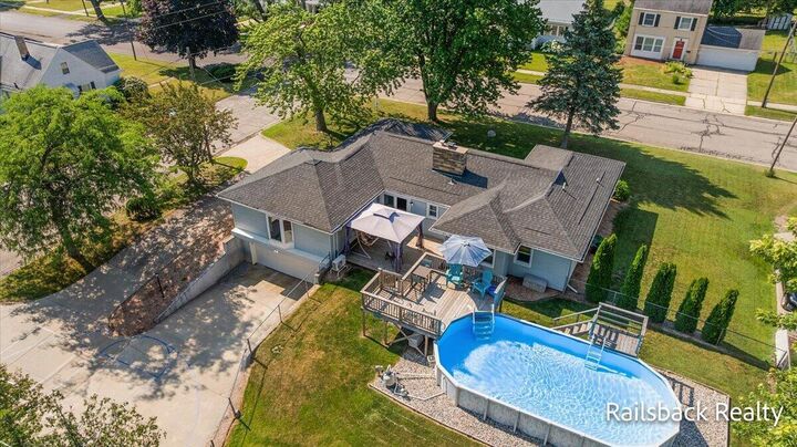 Property Photo:  85 Orchard Drive NW  MI 49345 
